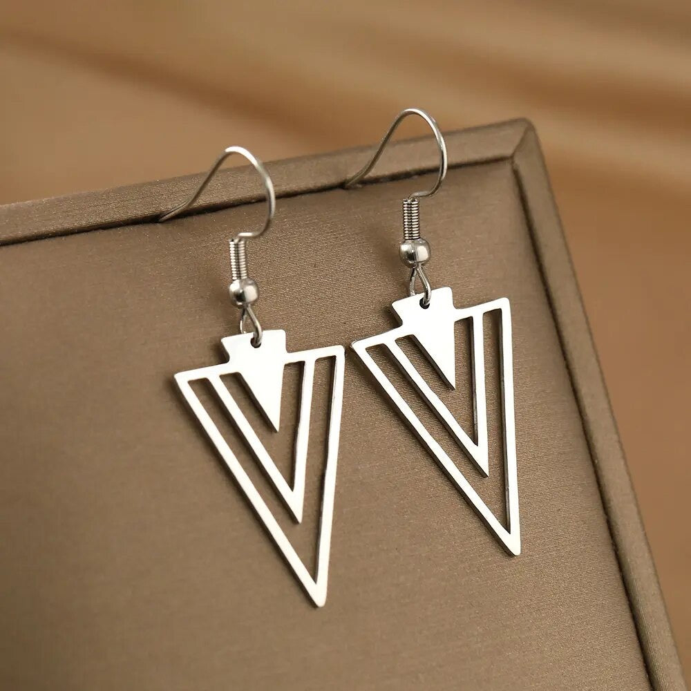 Silver triangle store dangle earrings